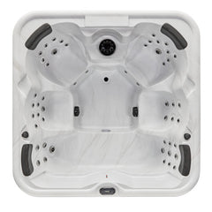 Luxury Spas Eclipse 6-person hot tub with sleek design, built-in jets, and LED lighting in a soft gray finish