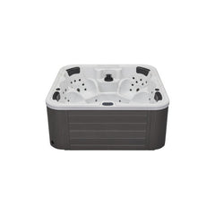 Luxury Spas Eclipse 6 Person hot tub with modern design, built-in jets, and soft seating, perfect for relaxation.