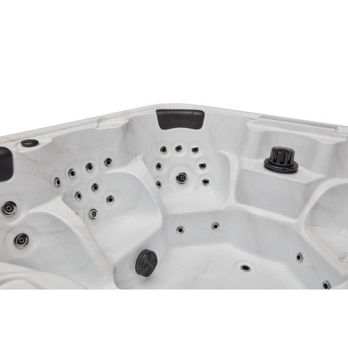 Luxury Spas Eclipse hot tub for 6, featuring a sleek design with a smooth surface and built-in LED lights.