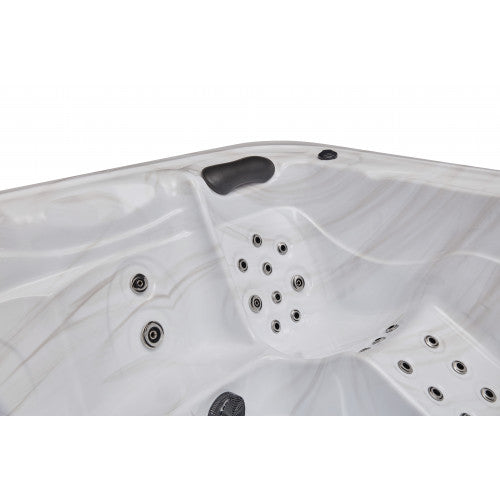 Luxury Spas 5-person hot tub with a sleek design, LED lights, and comfortable seating for relaxation and wellness.