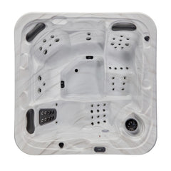 Luxury Spas 5-person hot tub with bubble jets and LED lighting, in a sleek modern design.