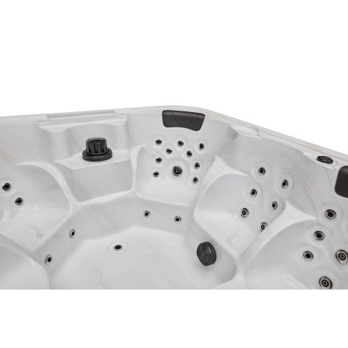 Luxury Spas Eclipse 6-person hot tub with sleek design and built-in LED lights, ideal for relaxation and home therapy.
