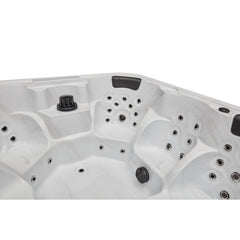Luxury Spas Eclipse 6-person hot tub with sleek design and built-in LED lights, ideal for relaxation and home therapy.