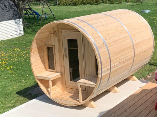 6-person Eastern white cedar barrel sauna with porch by Dundalk, featuring natural wood finish