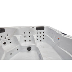 Luxury Spas Eclipse 6-person hot tub with a sleek design, comfortable seating, and built-in LED lighting.
