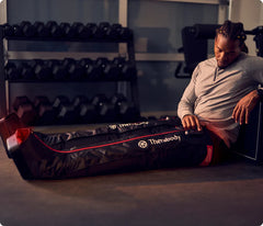 Person sitting with a Therabody Therabody jetboots pro plus