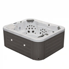 Luxury Spas Danika 5-person hot tub with gray exterior and built-in LED lights, perfect for relaxation and wellness.