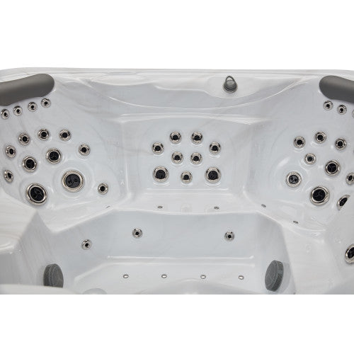Luxury Spas Danika 5-person hot tub with blue water, built-in LED lights, and comfortable seating