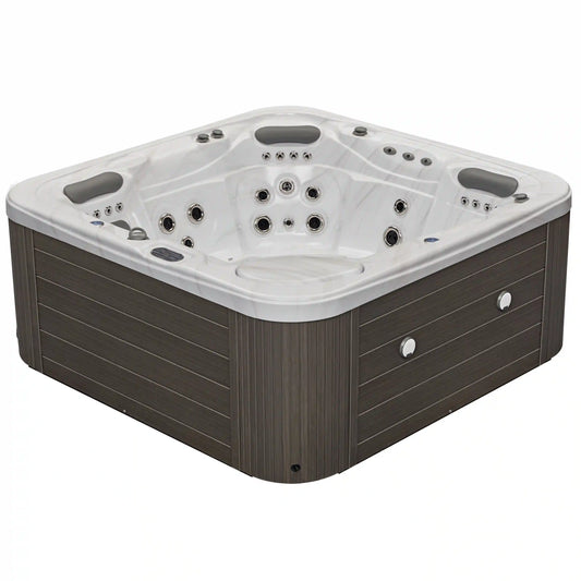 Luxury Spas Infinity 5-person hot tub with sleek design, jet systems, and blue acrylic finish.