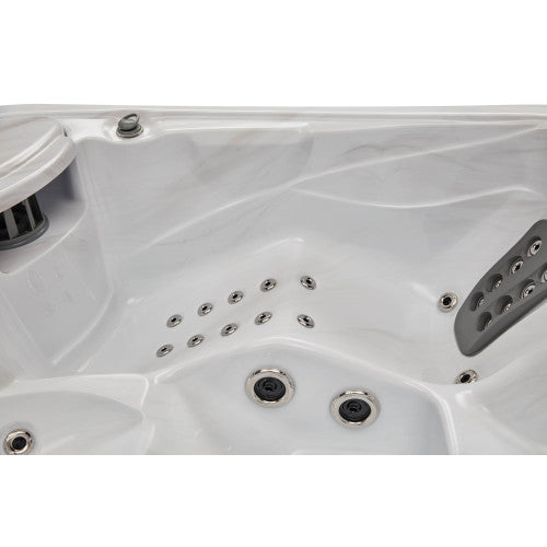 Luxury Spas Casey 3-person hot tub with a sleek design and built-in jets, ideal for relaxation and wellness.