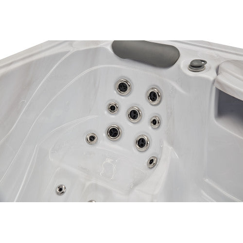 Luxury Spas Casey 3 person hot tub in white with built-in jets and LED lighting for relaxation and wellness.