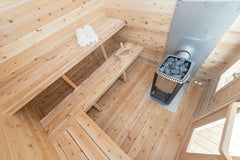 Dundalk cedar cabin sauna for 6 people with a metal roof, featuring natural wood finish and sturdy construction.