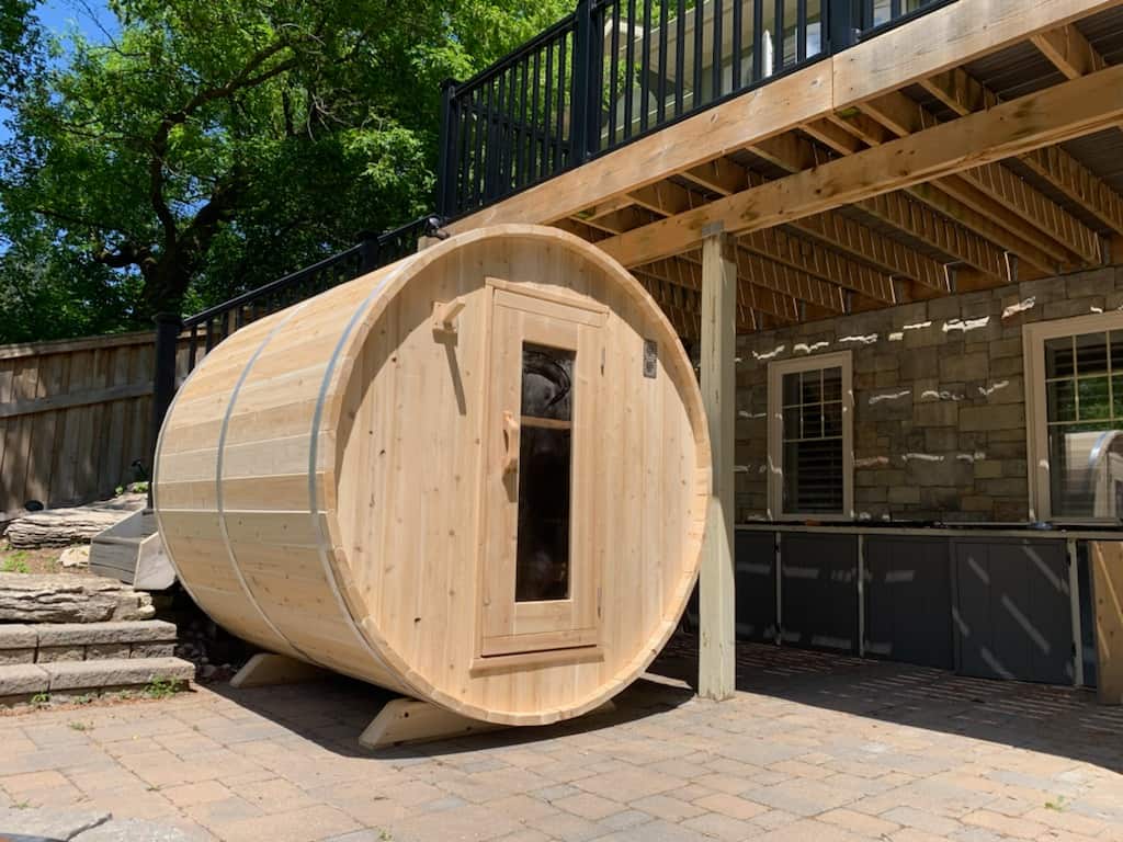 Dundalk 4-person Eastern white cedar barrel sauna with rounded design and natural wood finish