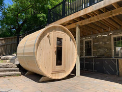 Dundalk 4-person Eastern white cedar barrel sauna with rounded design and natural wood finish